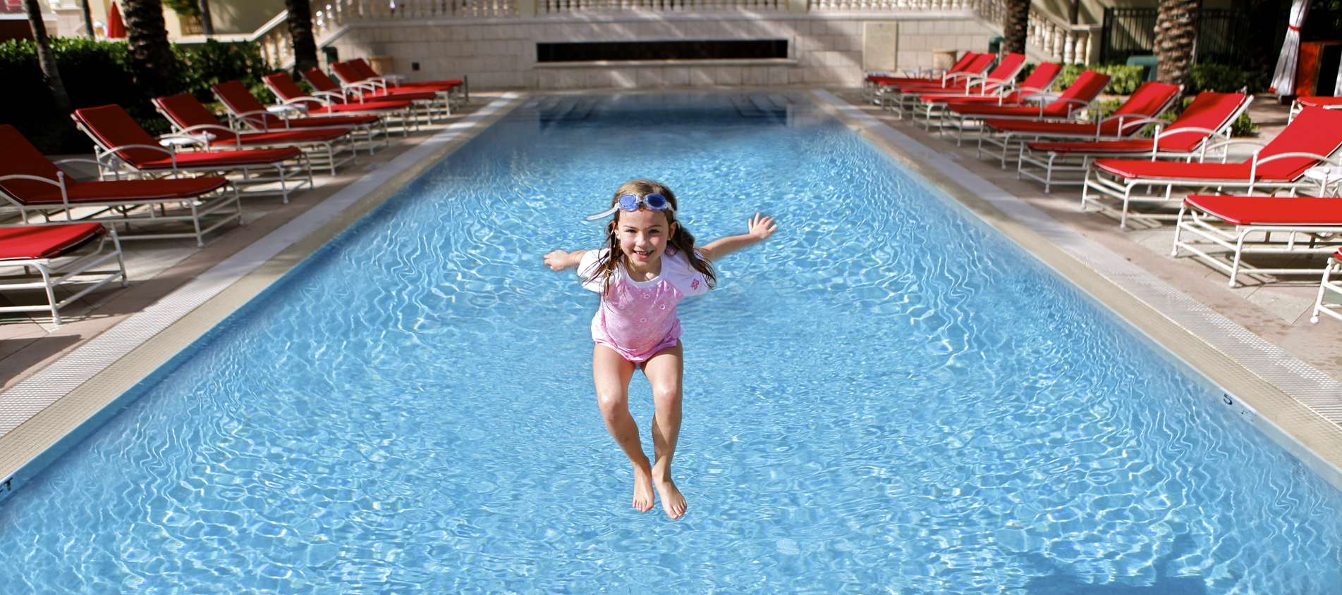 Girl Jumping Into Pool