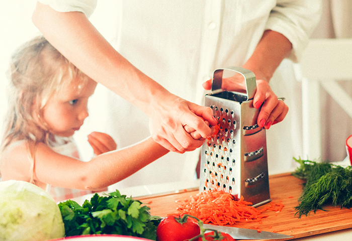 mom and daughter cooking