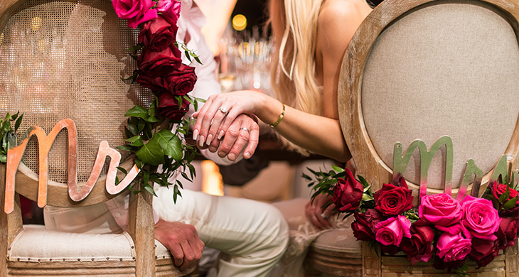 Decorated Mr & Mrs chairs at a wedding at Acqualina