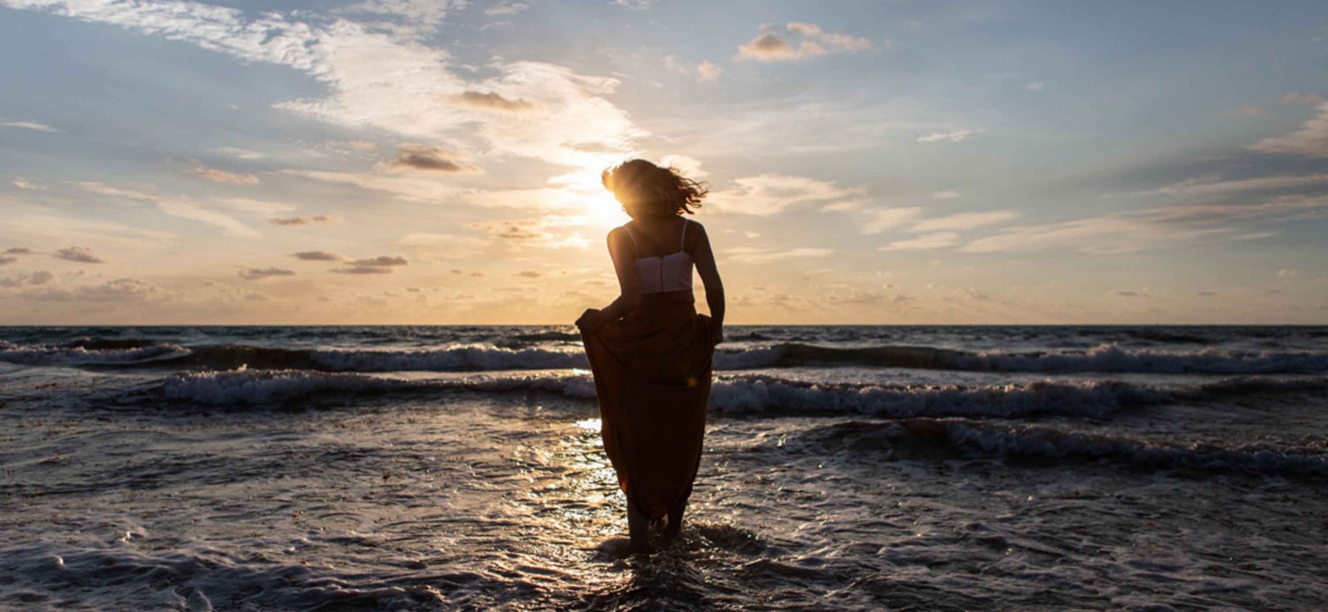 Woman walking in the tide in Miami, Florida