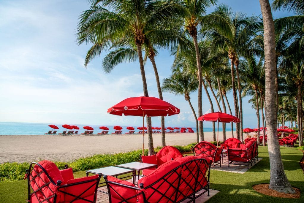 Acqualina's green lawn area and beach