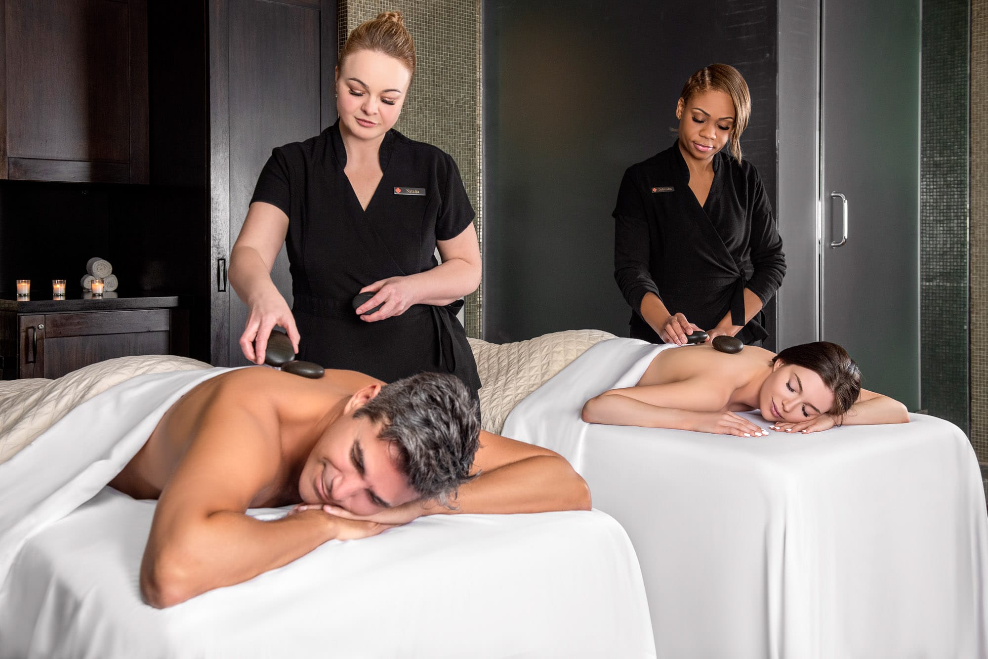 Couple Getting an Acqualina Spa's Hot Stone Massage Together at the Royal Couples Suite