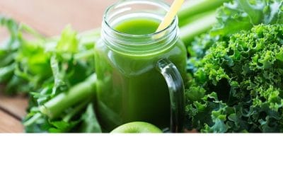green detox juice with fresh kale and celery
