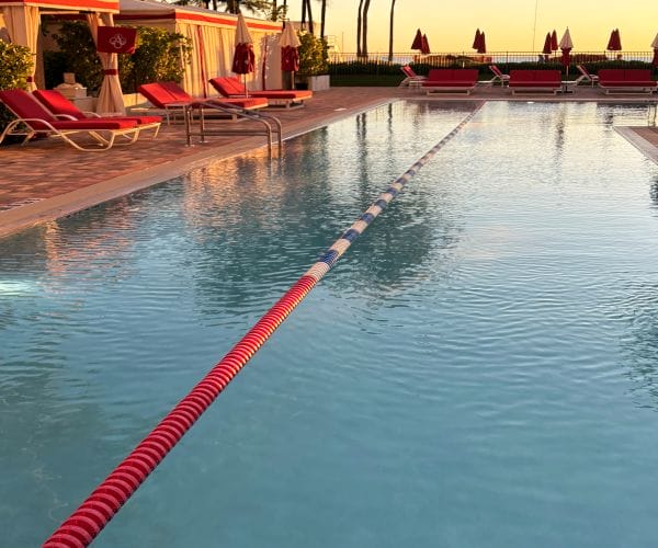 indoor lap swimming pool with lounge chairs