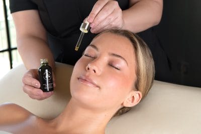 Woman getting Seed to Skin Signature Facial Serum